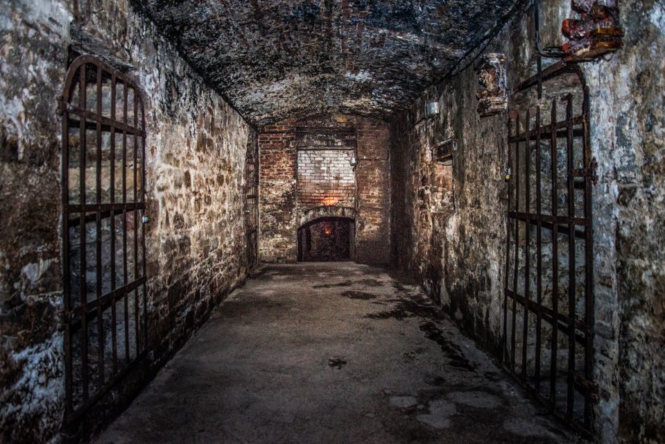 Edinburgh: Haunted Underground Vaults and Graveyard Tour - Entering the Edinburgh Vaults: tight stairs, stone arches, and scary questions